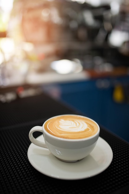 Hot latte art coffee on table relax time