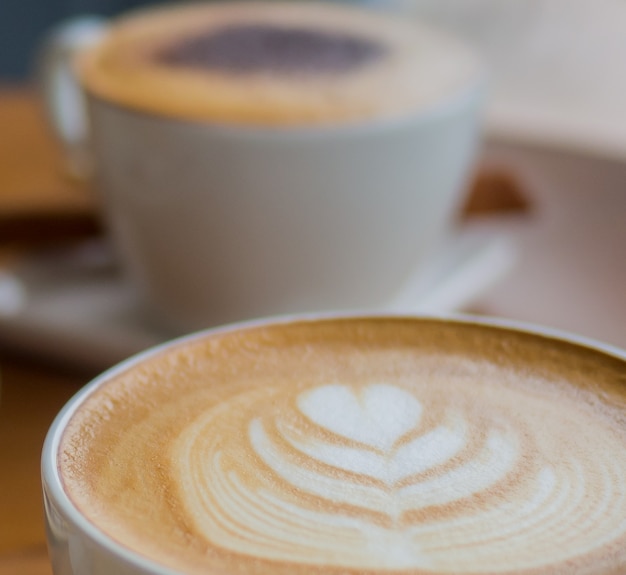 Hot latte art coffee in white cup