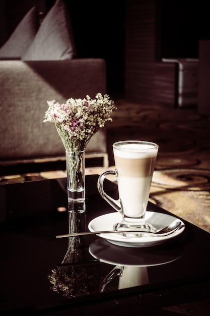 Hot latte coffee cup on table