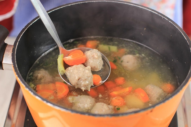 Hot Meatball Soup, Cooking Process Above the Stove. Vegatable Soup with Homemade Meatball