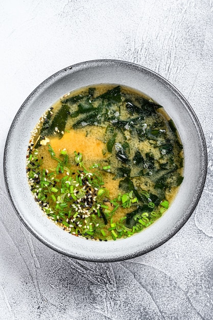 Hot miso soup in a gray bowl