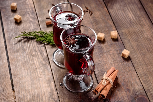 Hot mulled wine for winter and Christmas with various spices. Preparing for the Christmas holidays