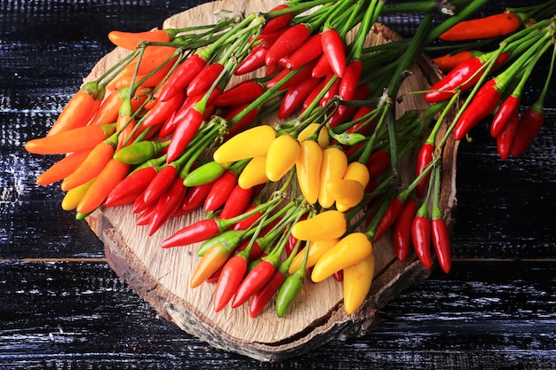 Hot pepper on a dark wooden table old colorful vintage retro bitterly spice style