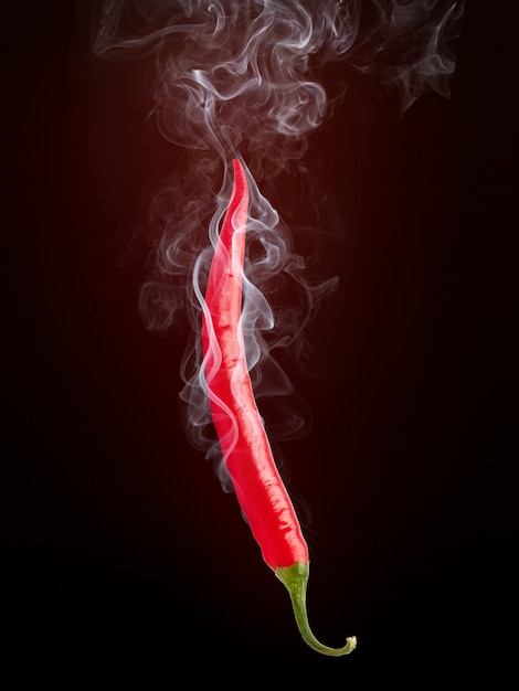 Photo hot pepper with smoke