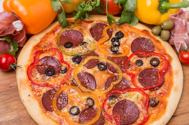 Hot pizza with garnish and components