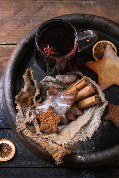 Hot red mulled wine with cookies 
