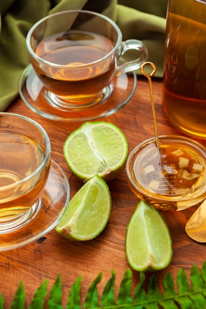 Hot refreshing citrus tea in glass close up