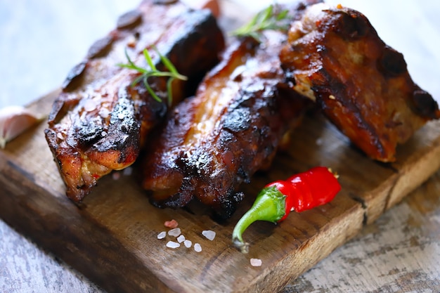 Hot ribs baked in honey and mustard sauce with chili pepper