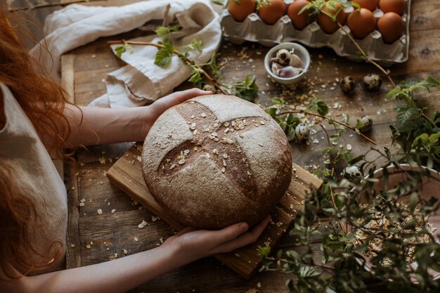 Hot rye bread on a wooden table served for dinner