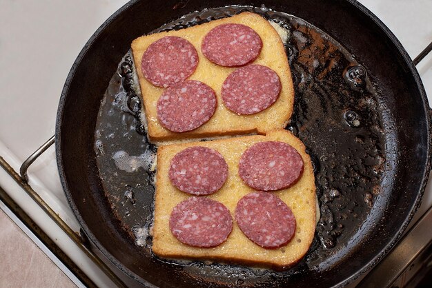 Hot sandwich bread and sausage lunch or breakfastxA