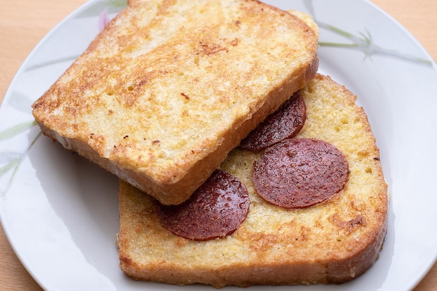 Hot sandwich bread and sausage lunch or breakfastxA