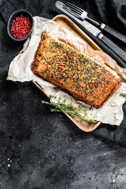 Hot smoked salmon fillet on a cutting Board.