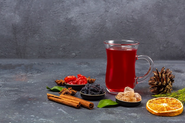 Hot spicy Christmas home made drink. Mulled wine, cranberry punch or Sangria with cranberries and orange for Christmas feast in oriental style. Winter holidays, new year concept. Close up