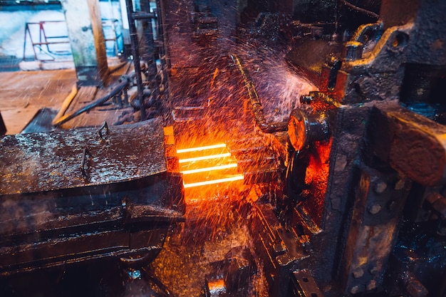 Photo hot steel on conveyor in steel mill