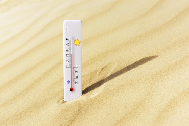 더운 여름날 모래 위의 섭씨 온도계 주변 온도 + 25도