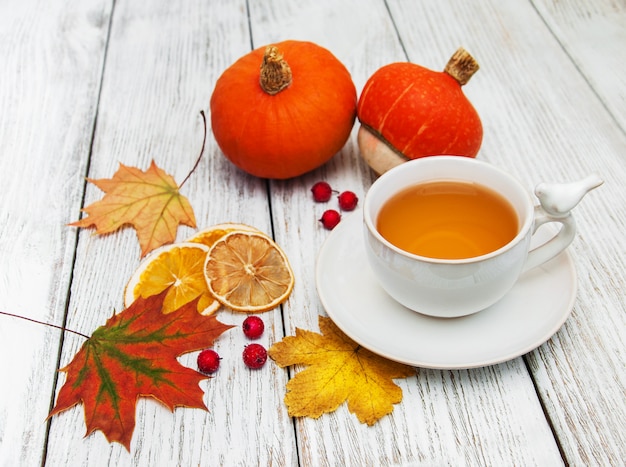 Hot tea and autumn leaves