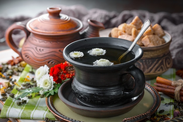 Hot tea in a cup on an old background