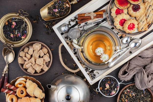 Hot tea in a cup on an old background