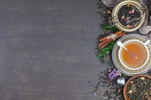 Hot tea in a cup on an old background