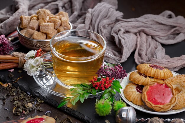 Hot tea in a cup on an old background.