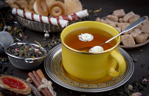 Hot tea in a cup on an old background.