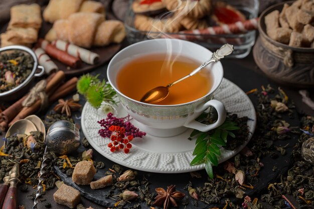 Hot tea in a cup on an old background