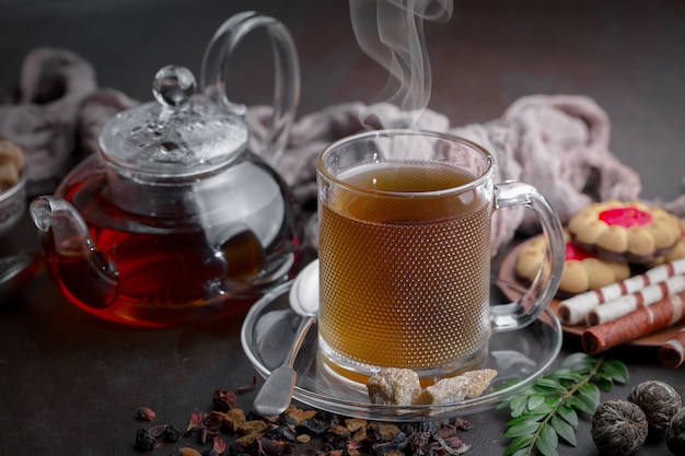 Hot tea in a cup on an old background