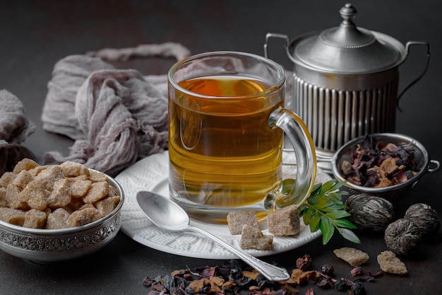 Hot tea in a cup on an old background