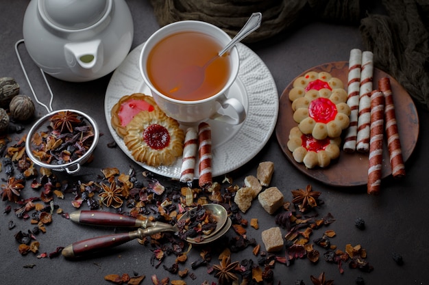 Hot tea in a cup on an old background