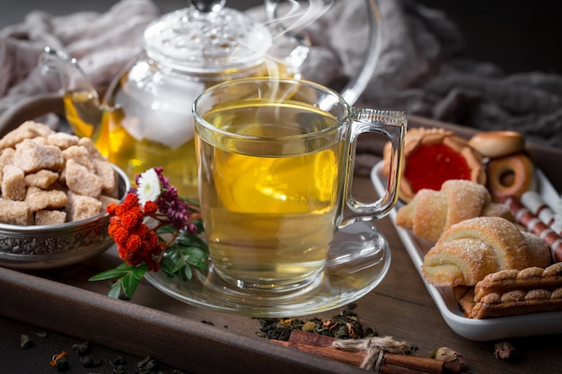 Hot tea in a cup on an old background