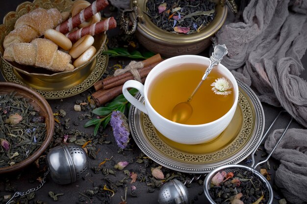 Hot tea in a cup on an old background