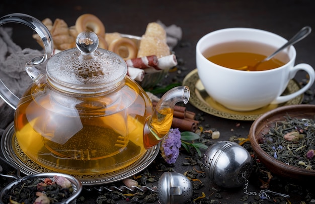 Hot tea in a cup on an old background