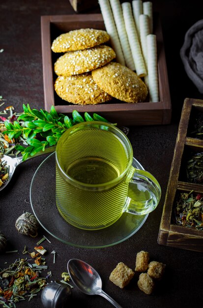 Hot tea in a cup on an old table.