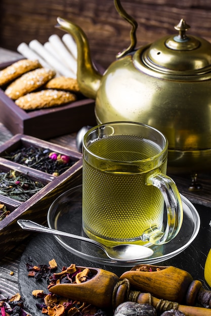 Hot tea in a cup on an old table.