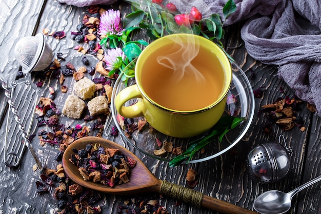 Hot tea in a cup on an old table.