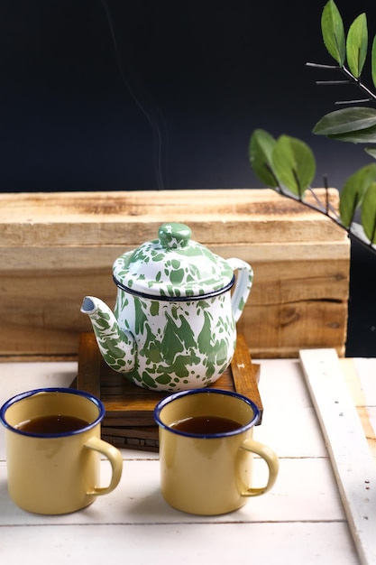 hot tea on vintage enamel teapot