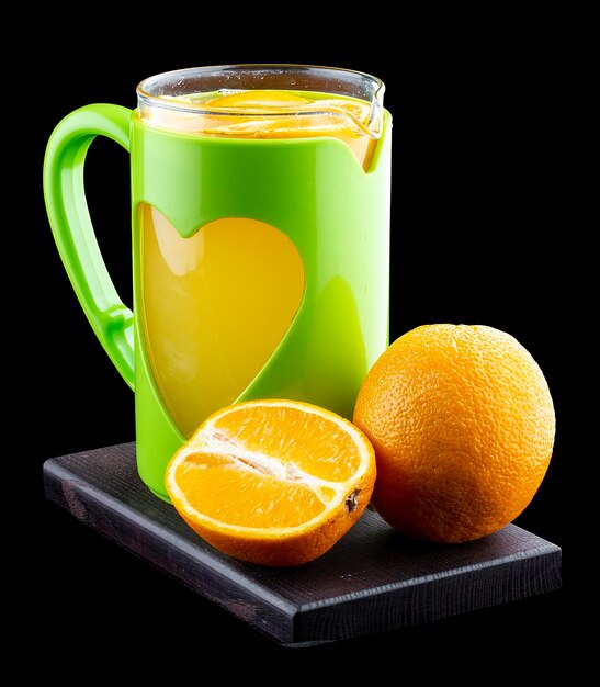 Hot tea with oranges and lemon on a black background