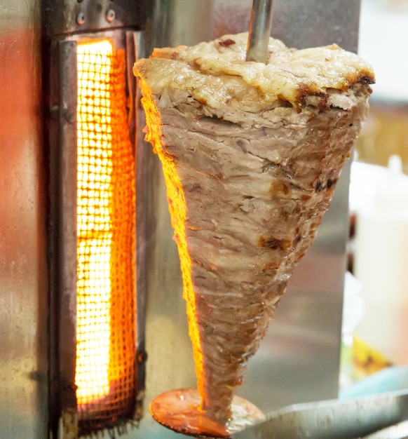 Photo hot turkish chicken doner kebab, focus selective.