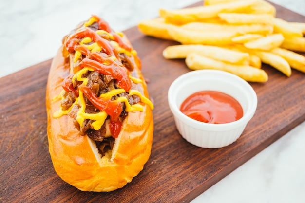 Hotdog with french fries and tomato sauce