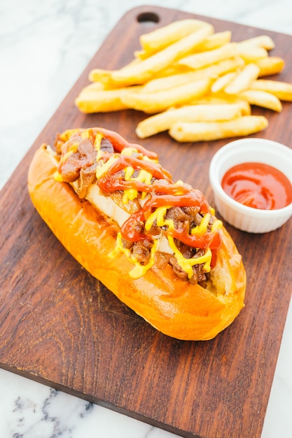 Hotdog with french fries and tomato sauce