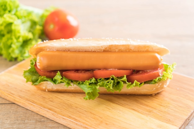 Hotdog with sausage and tomato