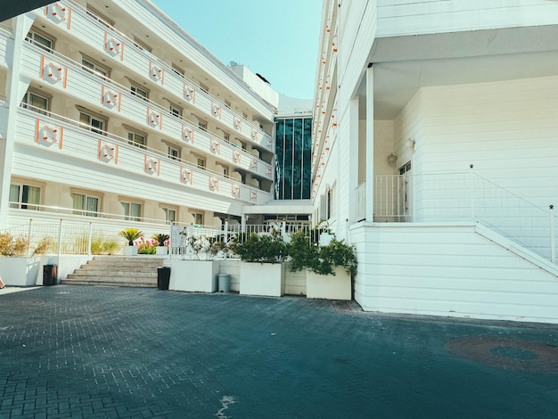 Hotel area in a hot tropical country the hotel building is whitewashed next to it is wellgroomed