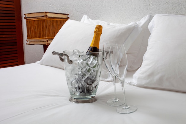 Hotel bed with champagne