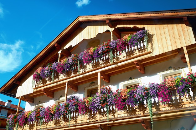 Hotel building with colorful flowers on balconies