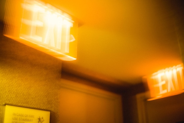 Hotel exit sign in corridor