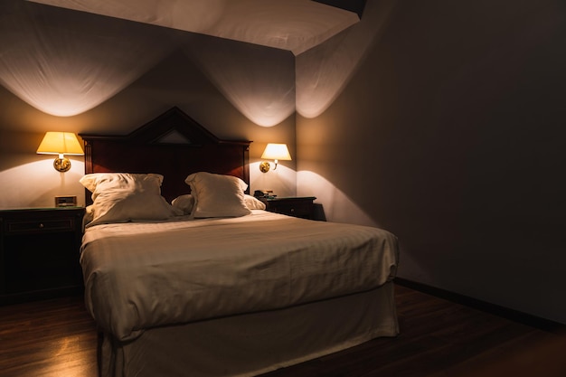 Hotel room at night with lamps on