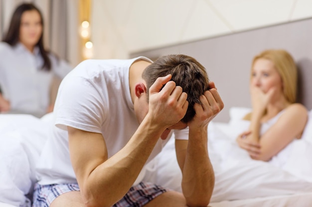 hotel, travel, relationships and sexual problems concept - wife caught man cheating with another woman