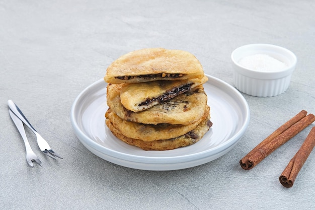 Hotteok South Korean pancakes or fried dough with nuts and sugar filling traditional street food