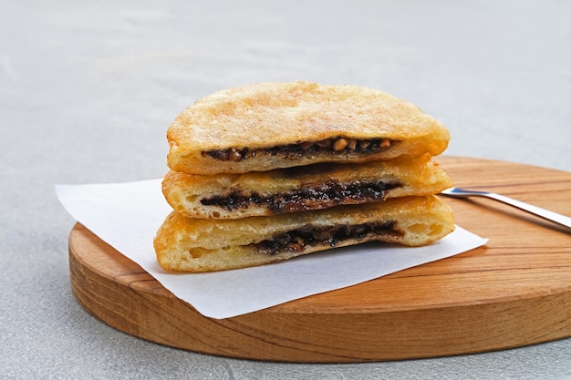 Hotteok South Korean pancakes or fried dough with nuts and sugar filling traditional street food