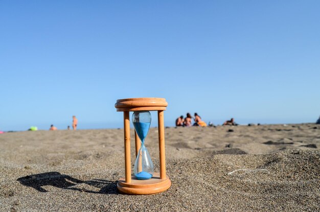 Hourglass Clock on the Sand Beach